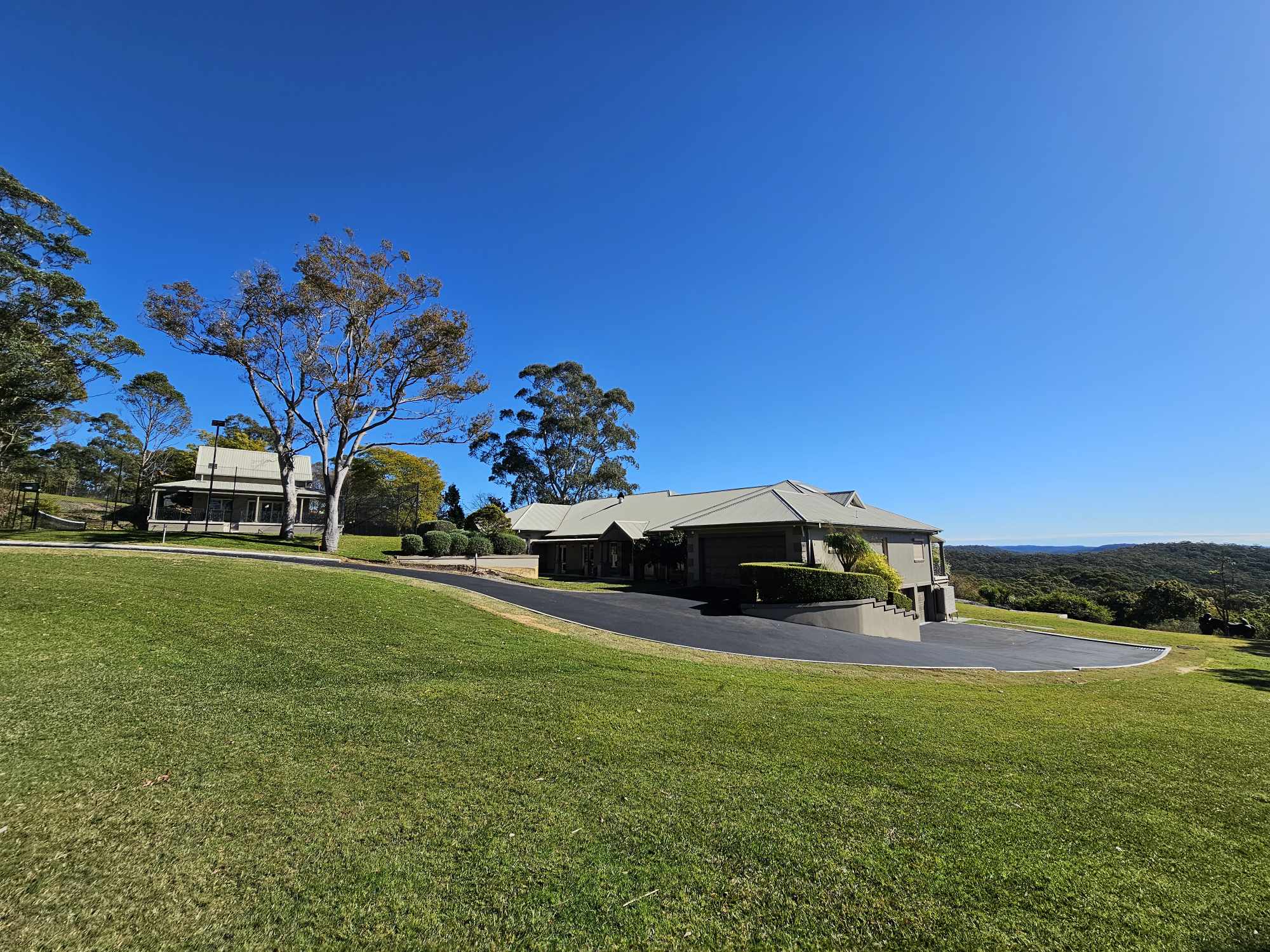 mansion with new asphalt drive